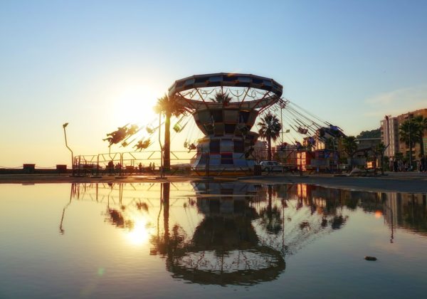 Carousel running against the sunset in Durrës, Albania.
