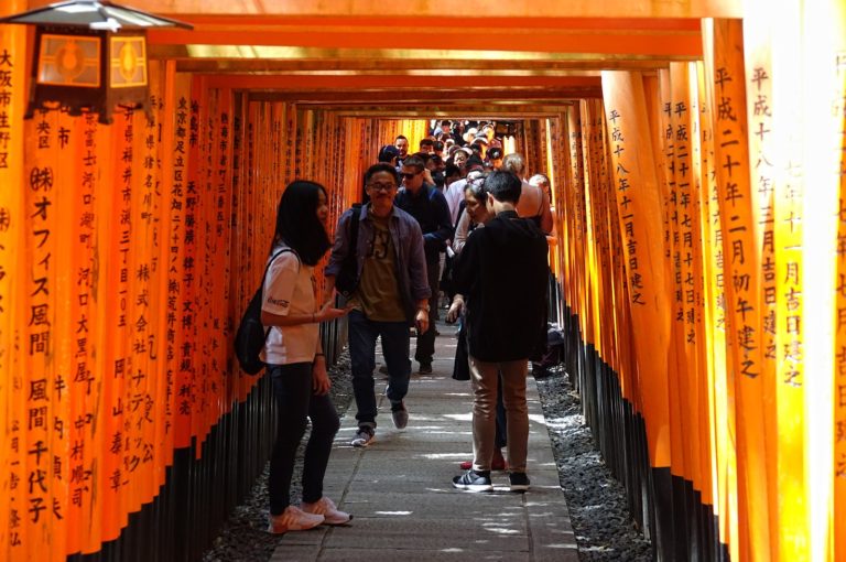 Crowded torii tunnel at Fushimi Inari.