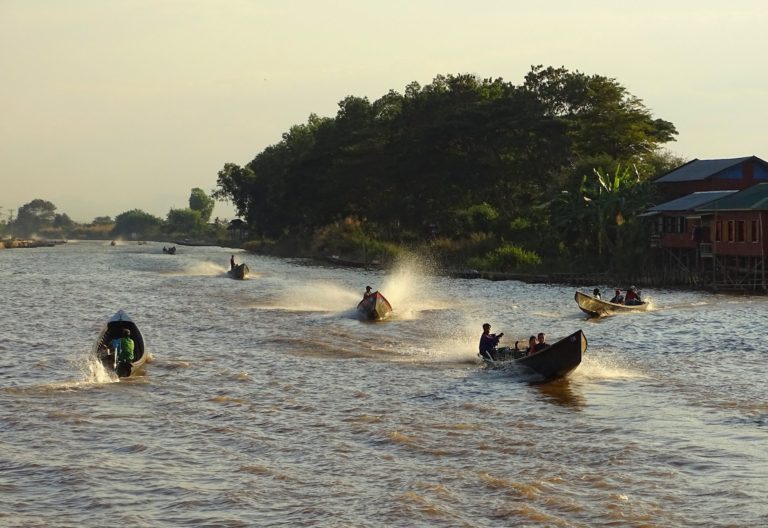 Boats coming in to Nyaung Shwe from the lake before sunset.