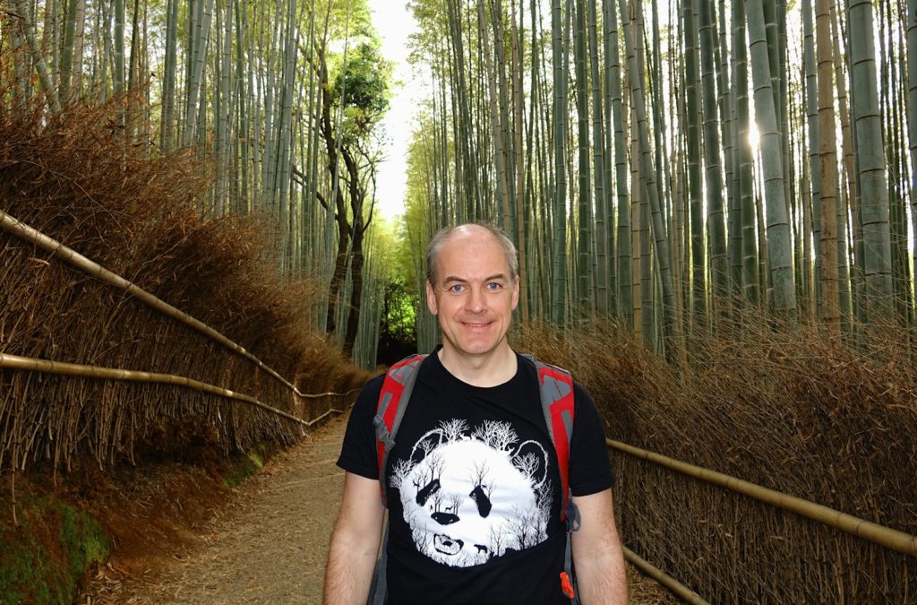 Photo of suitably dressed man visiting the bamboo forest of Arashiyama in Kyoto, Japan.