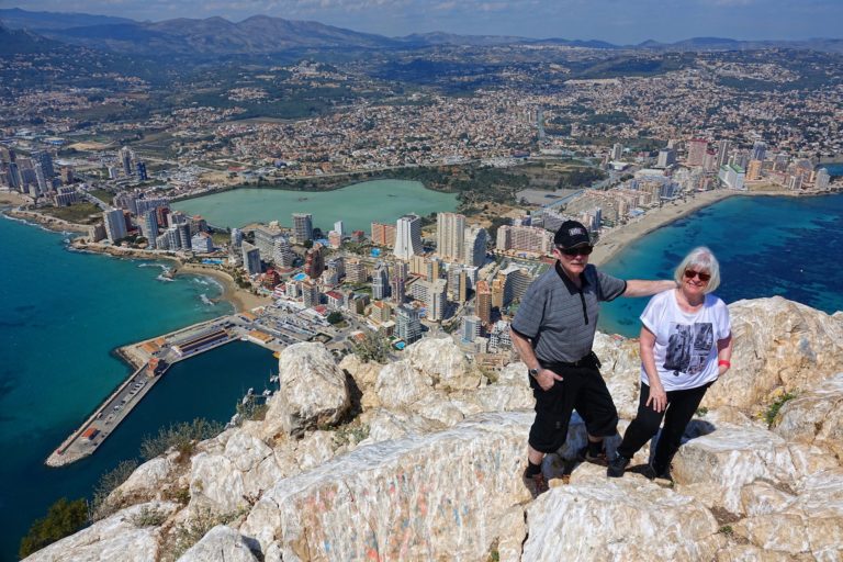 Photo of hikers on top of the cliff in Calp, Spain.