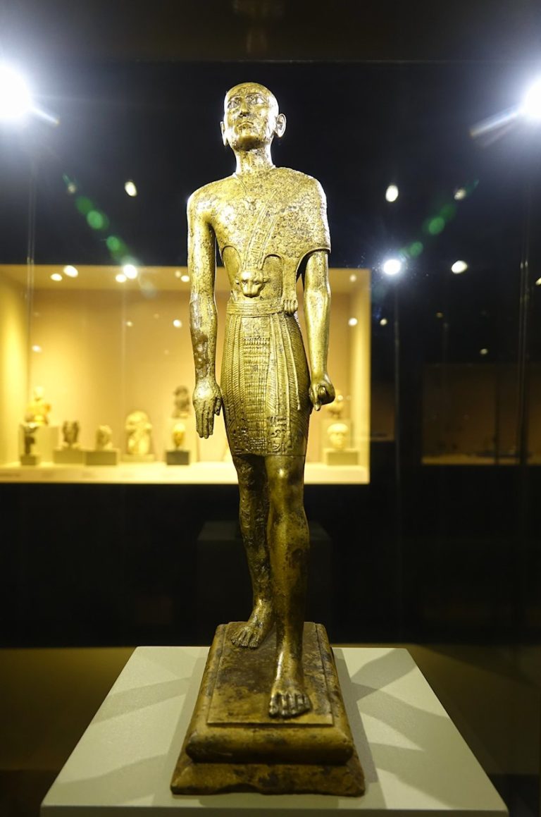 Photo of golden Egyptian priest at museum in Selcuk, Turkey.
