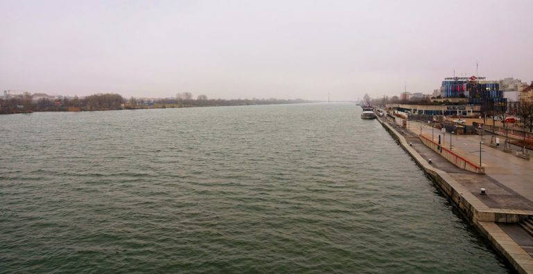 Photo of Donau/Danube floating past Vienna/Wien, Austria on a grey day in January.