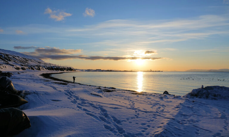 Photo of sunset on the beach in Longyearbyen, Norway.