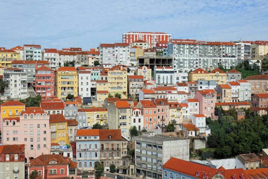 Photo of so many colorful buildings in Coimbra, Portugal.
