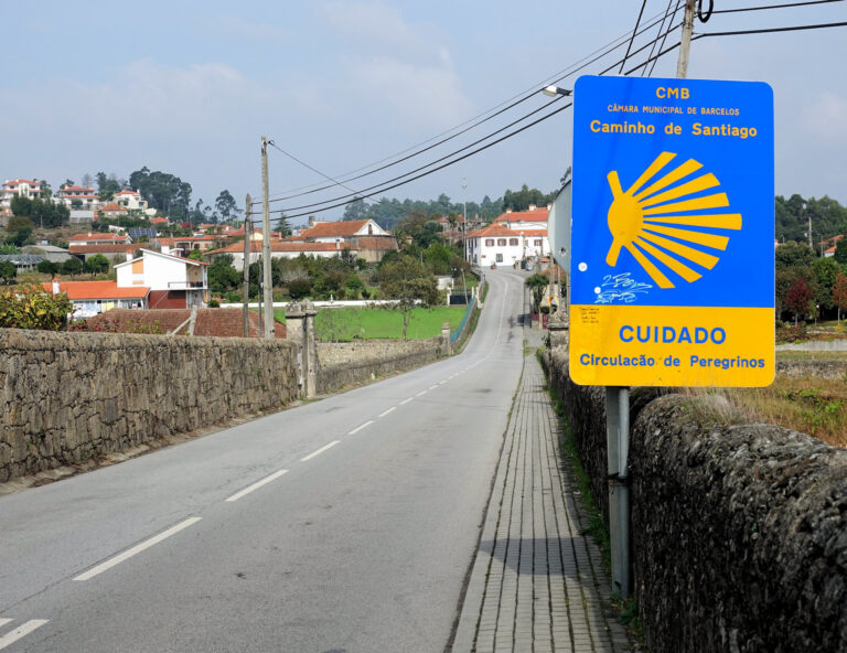 Photo of sign warning of there being pilgrims roaming in the area in Portugal.