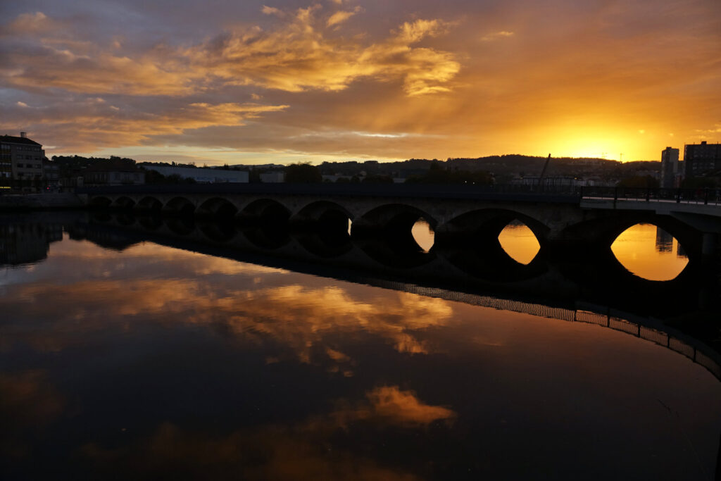 Photo of Ponte do Burgo in Pontevedra, Spain, at sunrise.